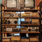vintage television and radios on a stand