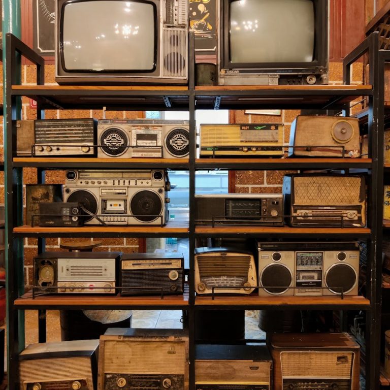vintage television and radios on a stand
