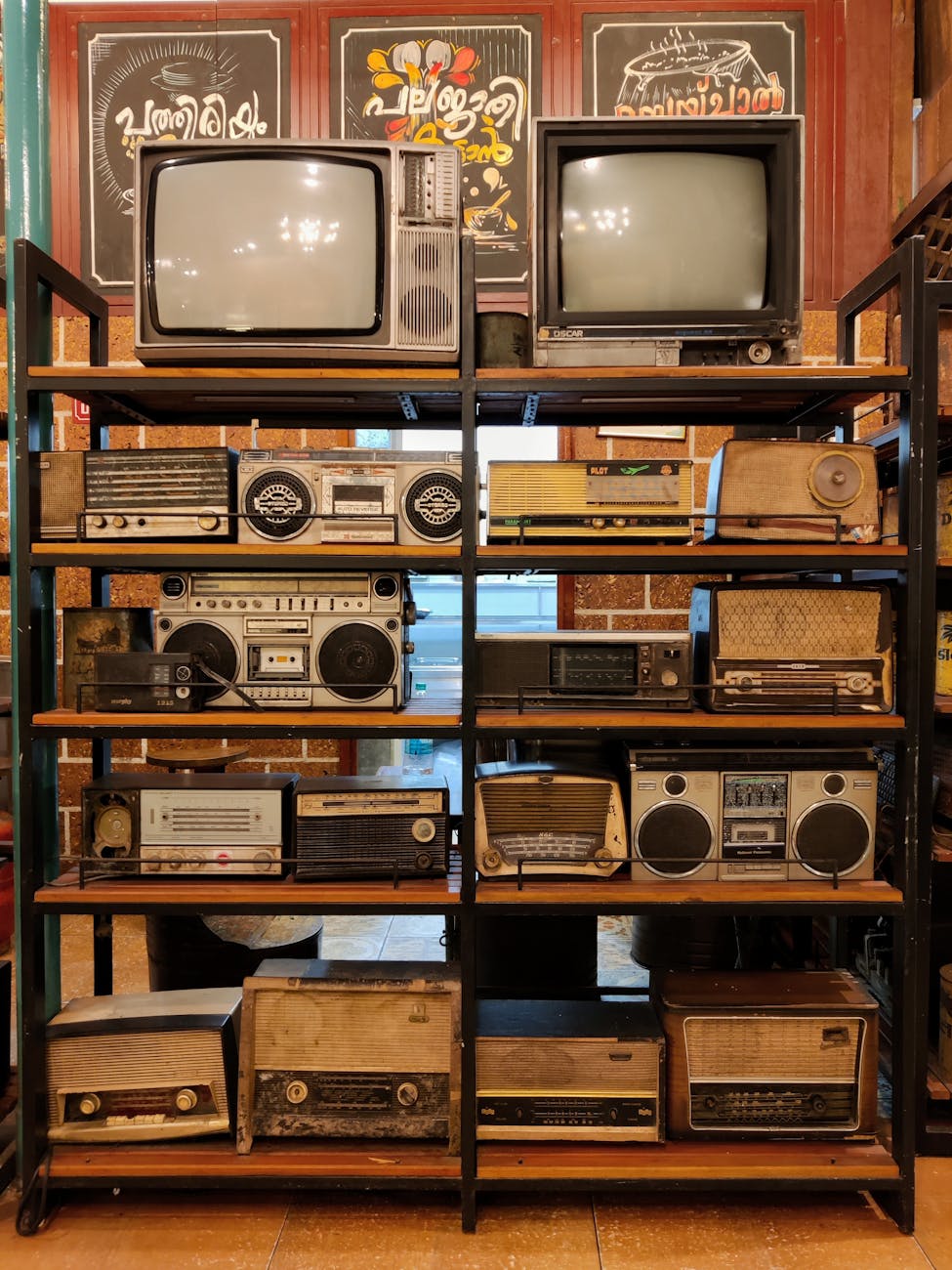 vintage television and radios on a stand